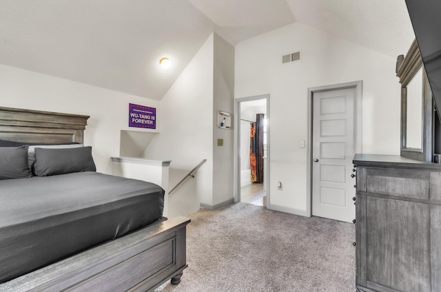 carpeted bedroom featuring vaulted ceiling