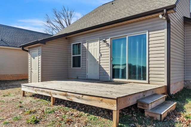 rear view of house with a wooden deck