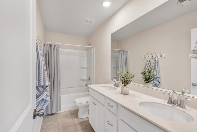 full bathroom with shower / bathtub combination with curtain, vanity, tile patterned flooring, and toilet