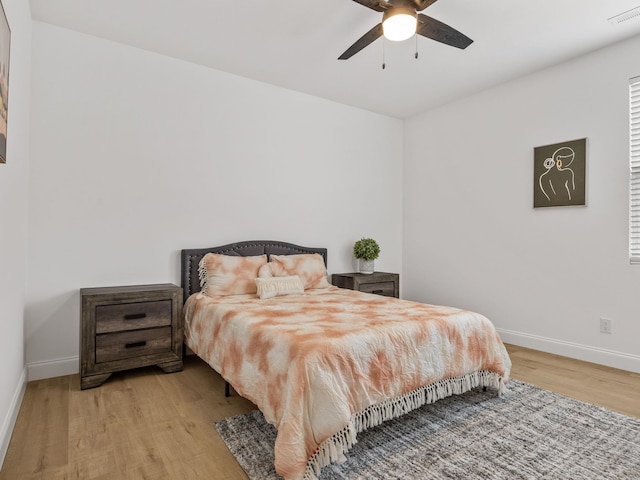 bedroom featuring light hardwood / wood-style flooring and ceiling fan