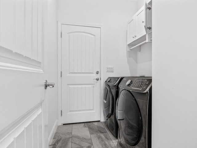 laundry area featuring cabinets and independent washer and dryer