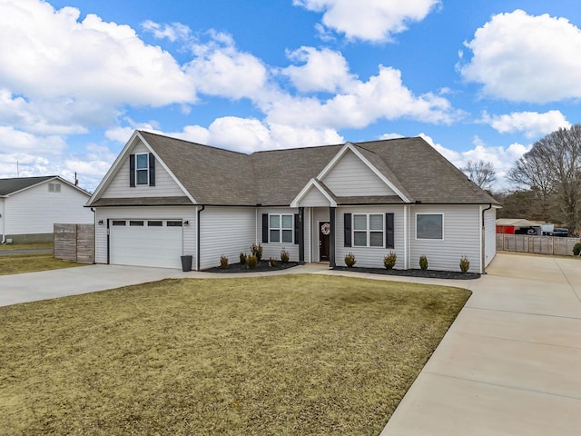 view of front of home with a garage and a front yard