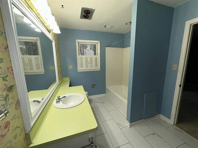 bathroom with vanity and separate shower and tub