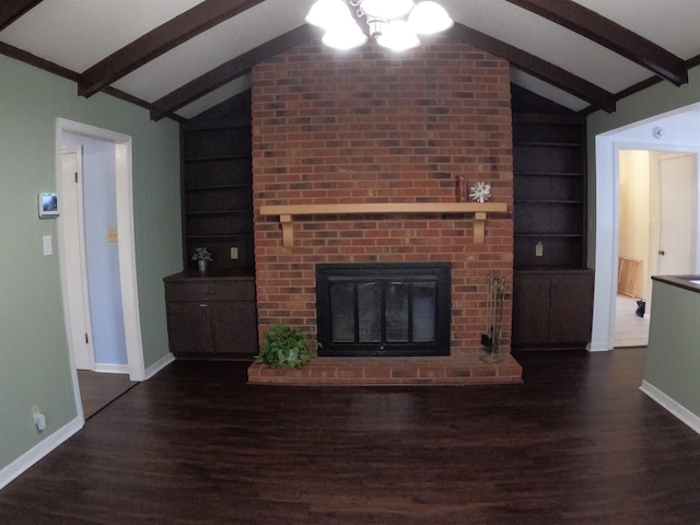 unfurnished living room with vaulted ceiling with beams, dark wood-type flooring, built in features, and a fireplace