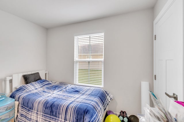 bedroom featuring multiple windows