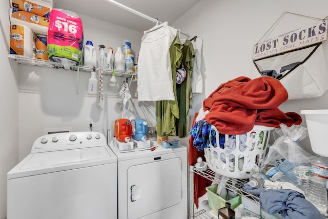 washroom with washing machine and clothes dryer