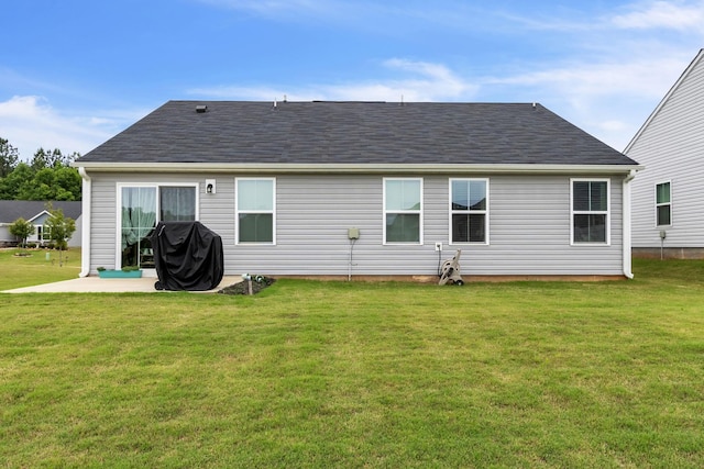 back of house featuring a yard and a patio