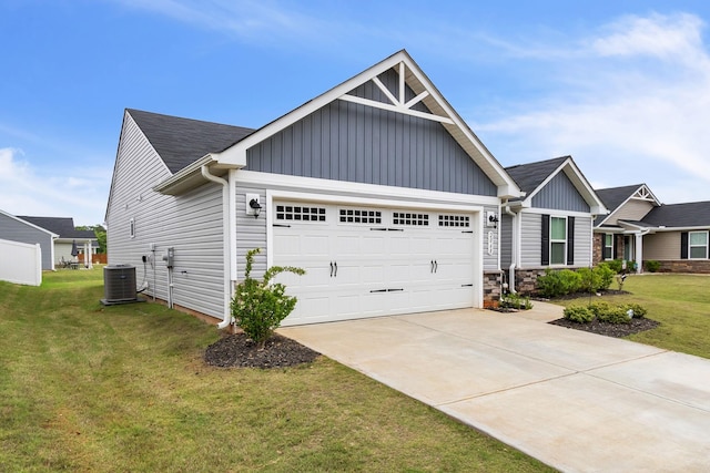 craftsman-style house with a garage, a front lawn, and central air condition unit