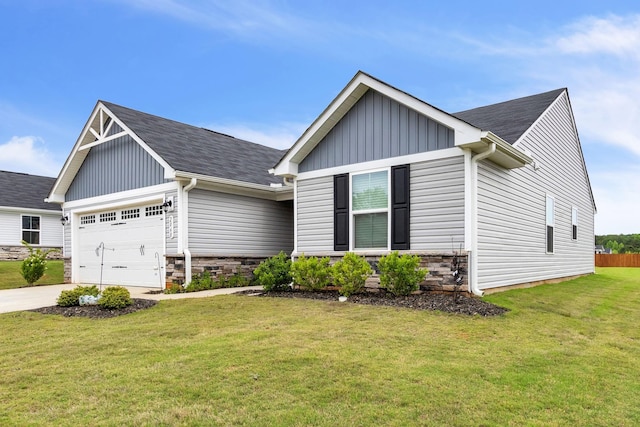 view of front of home featuring a garage and a front yard