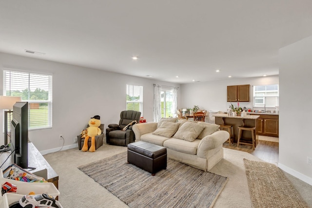 living room with light colored carpet