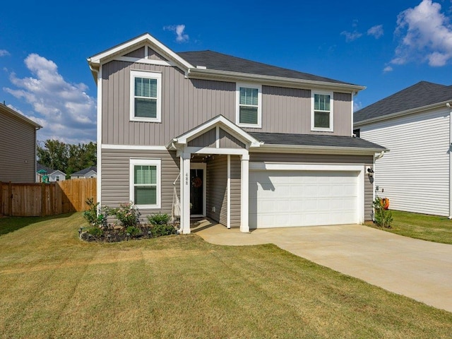 view of front of property with a garage and a front lawn