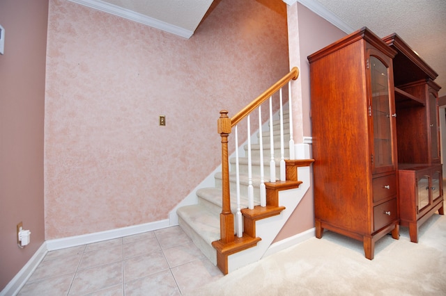 stairs featuring crown molding, tile patterned floors, and a textured ceiling