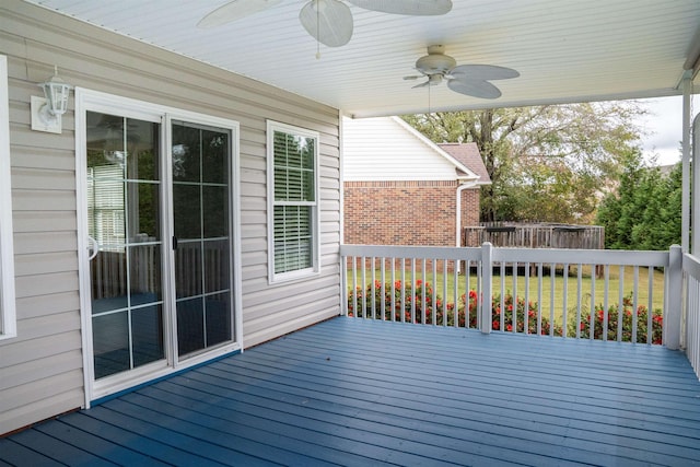 wooden deck featuring ceiling fan