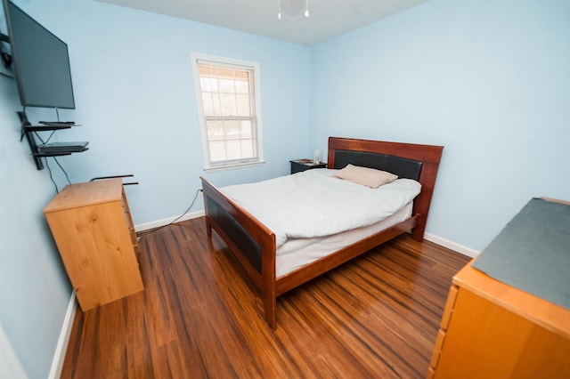 bedroom featuring dark hardwood / wood-style flooring