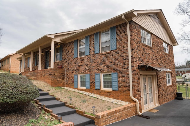 view of side of home with french doors