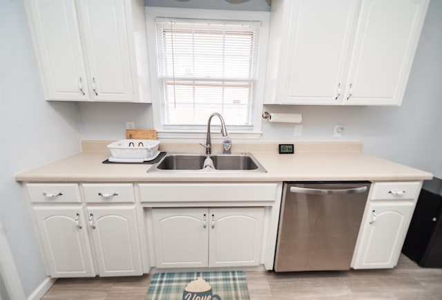 kitchen featuring white cabinetry, dishwasher, sink, and light hardwood / wood-style floors