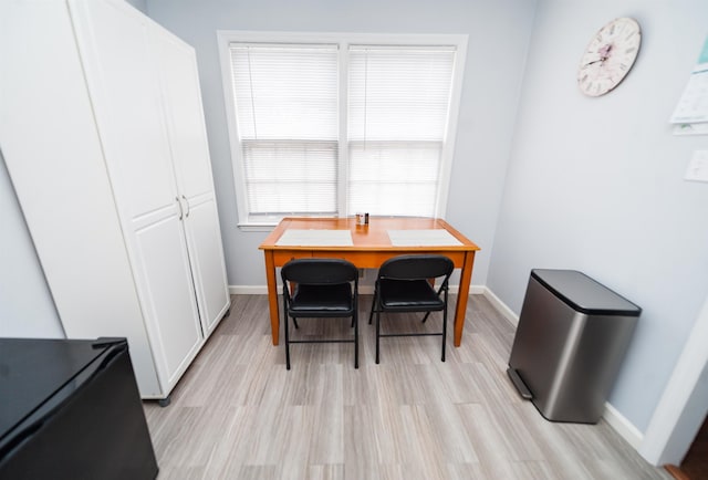 dining room with light hardwood / wood-style flooring