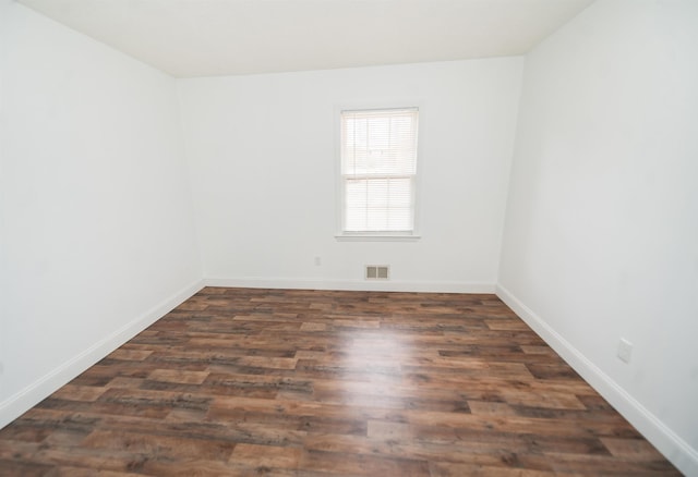 empty room featuring dark hardwood / wood-style floors