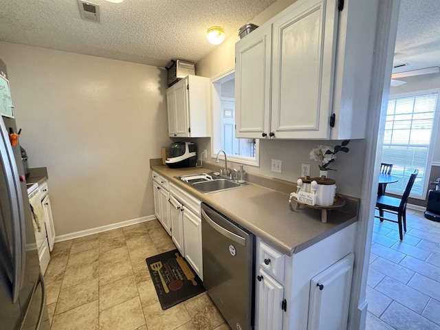 kitchen with white cabinetry, stainless steel dishwasher, and sink