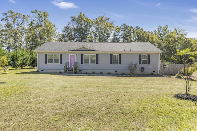 ranch-style home featuring a front yard