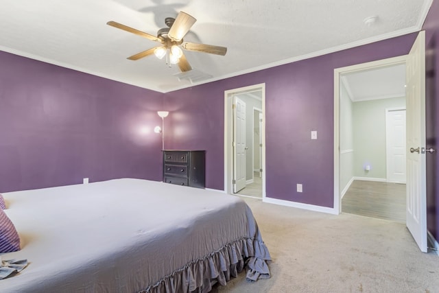 carpeted bedroom with crown molding and ceiling fan