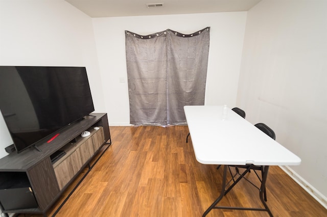 office with dark wood-type flooring