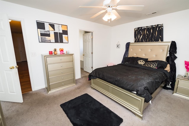 bedroom with light carpet and ceiling fan