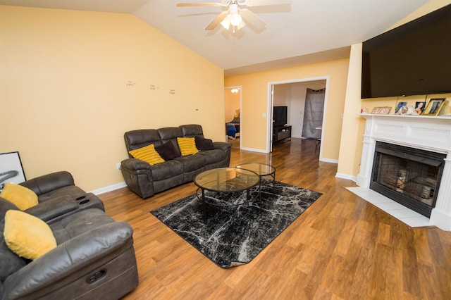 living room featuring lofted ceiling, wood-type flooring, and ceiling fan