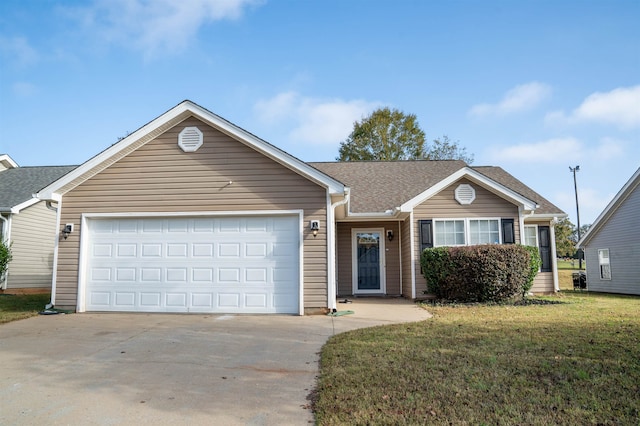 ranch-style house featuring a garage and a front yard