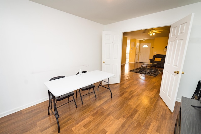 home office with ceiling fan and wood-type flooring