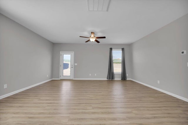 spare room with ceiling fan and light hardwood / wood-style flooring