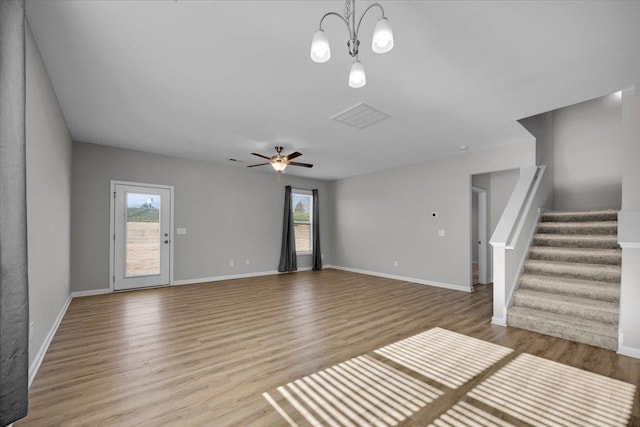 unfurnished living room with ceiling fan, plenty of natural light, and light hardwood / wood-style floors