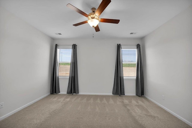 empty room with light carpet and ceiling fan