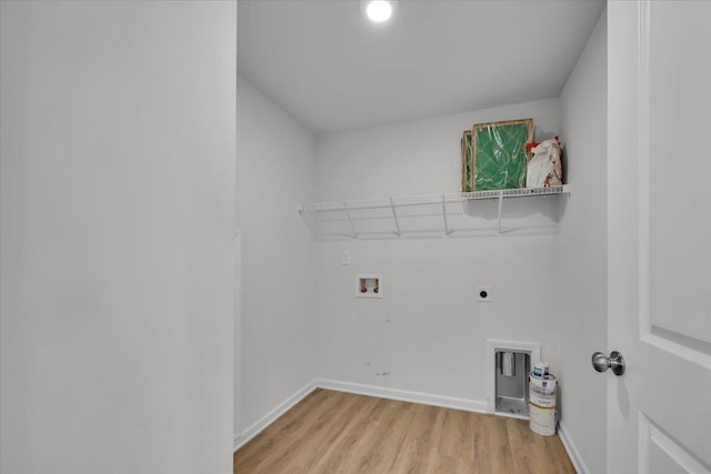 laundry area with hookup for a washing machine, hookup for an electric dryer, and hardwood / wood-style flooring