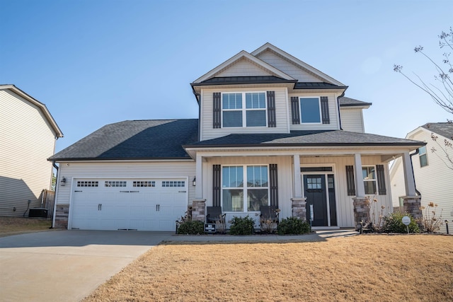 craftsman-style house featuring a porch, a garage, and a front lawn