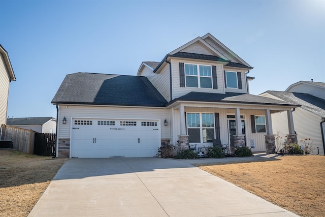 craftsman inspired home with a garage, a front yard, and covered porch