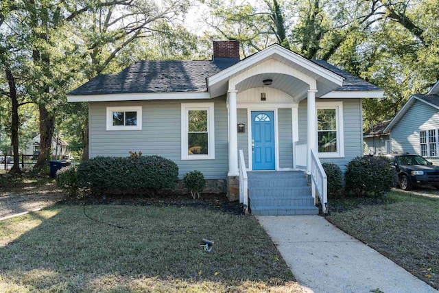 bungalow with a front lawn