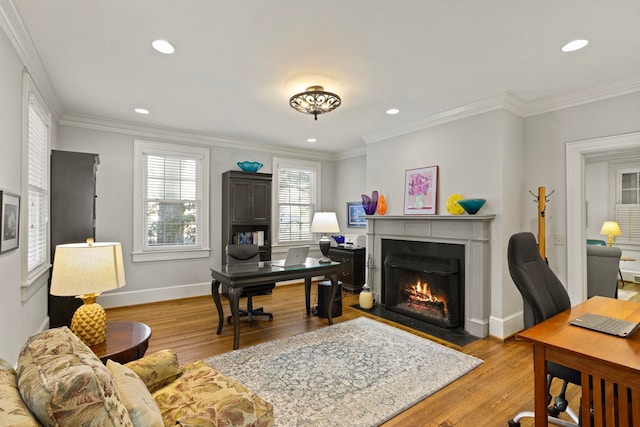 home office with ornamental molding and light wood-type flooring