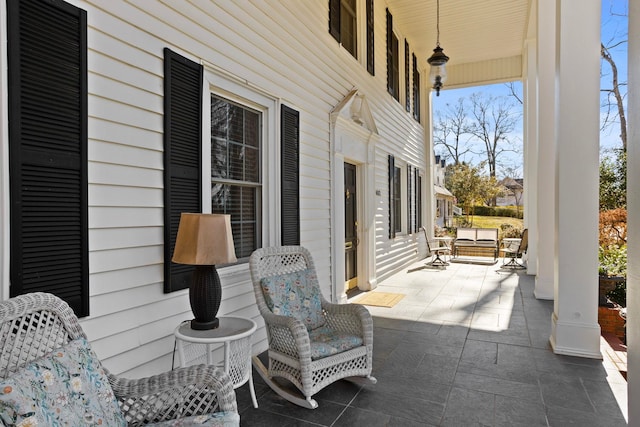 view of patio featuring covered porch