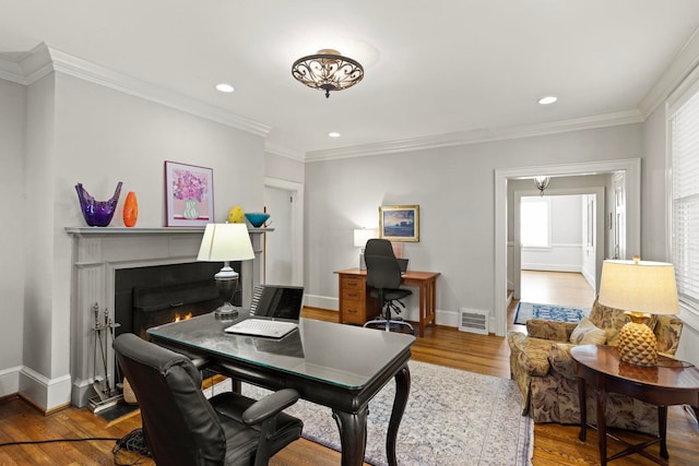 office area with hardwood / wood-style flooring and ornamental molding