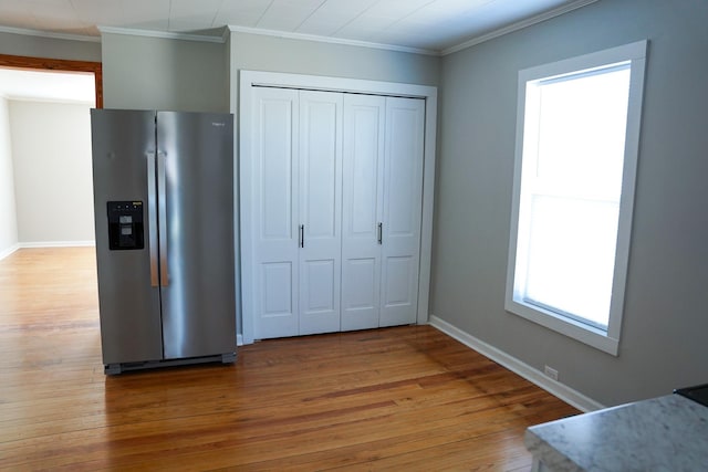 kitchen with stainless steel fridge with ice dispenser, crown molding, and wood-type flooring