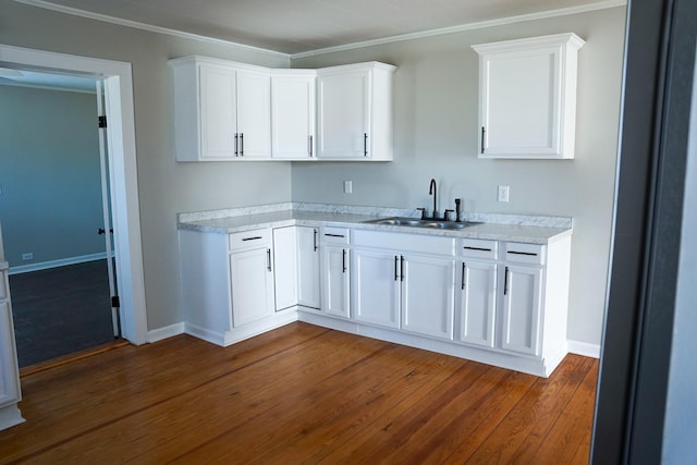 kitchen featuring white cabinetry, sink, and dark hardwood / wood-style flooring