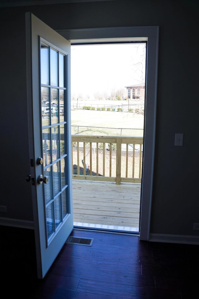 doorway to outside featuring dark hardwood / wood-style floors