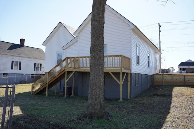 back of house with central AC and a deck