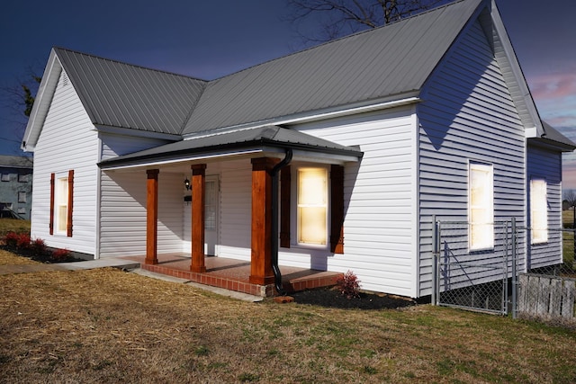 exterior space with a yard and covered porch