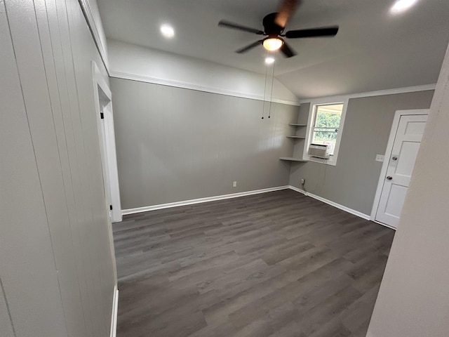 unfurnished room with dark hardwood / wood-style flooring, cooling unit, vaulted ceiling, and ceiling fan