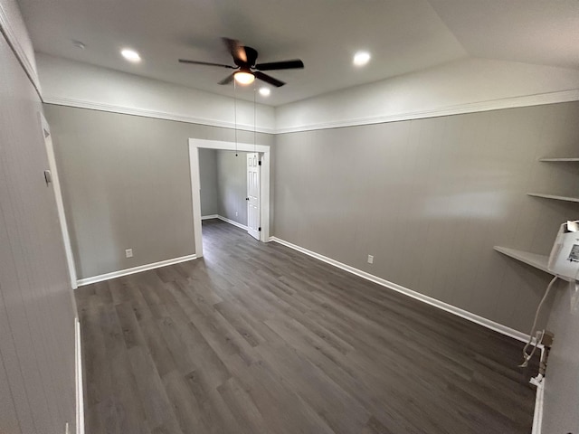 empty room with ceiling fan and dark hardwood / wood-style floors