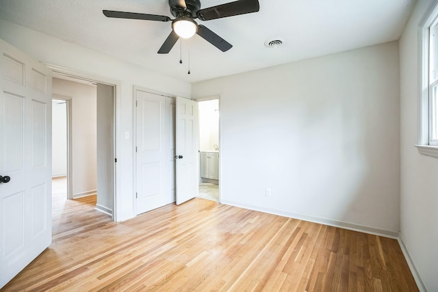 unfurnished bedroom featuring ceiling fan and light wood-type flooring