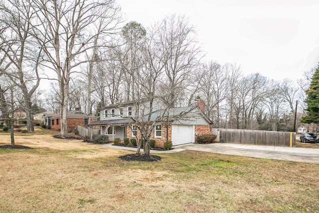 view of front of house with a garage and a front yard