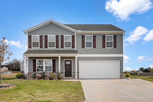 view of front of property with a garage and a front yard